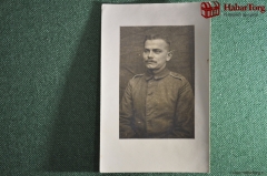 Фотография времен Первой мировой войны 1914-1918 гг. Военный с погонами, в форменной одежде.